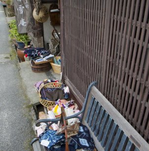 Scraps of kimono fabric line this storefront