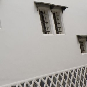 Window and wall detail of a gallery-house