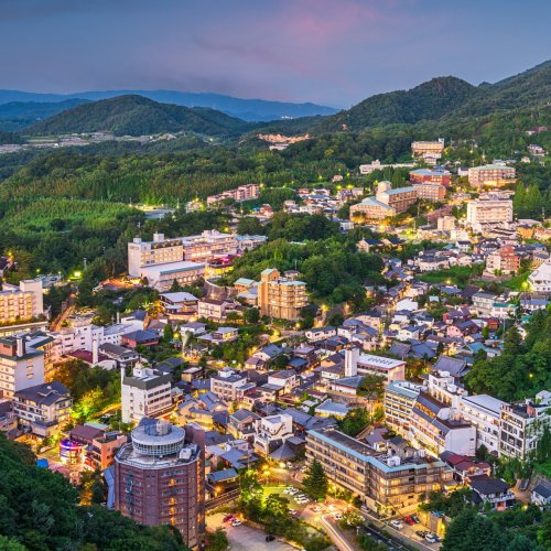 Arima onsen town coming to life as the sun sets over Mt. Rokko