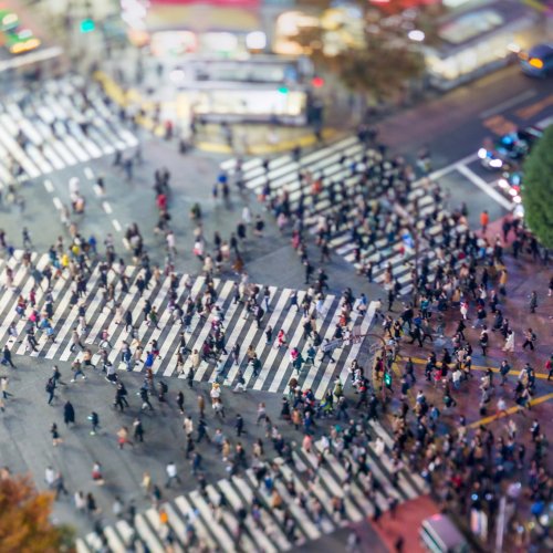 People swarming across the road at Shibuya Crossing