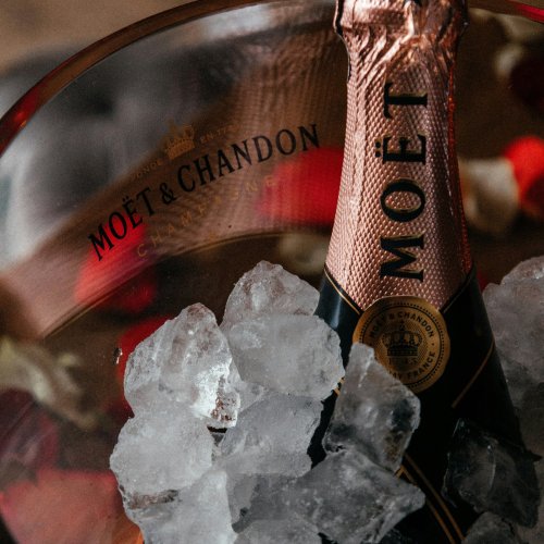 A bottle of champagne on ice